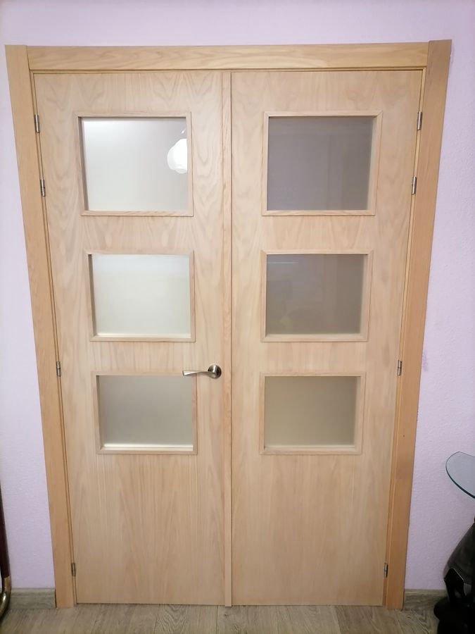 Puerta doble acristalada